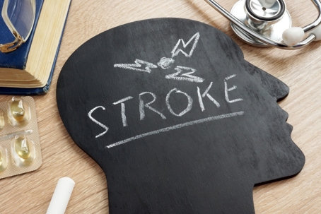 Head-shaped chalk board with the word "Stroke" written on it